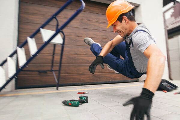 Business Insurance - Worker Falling Off a Ladder in an Office
